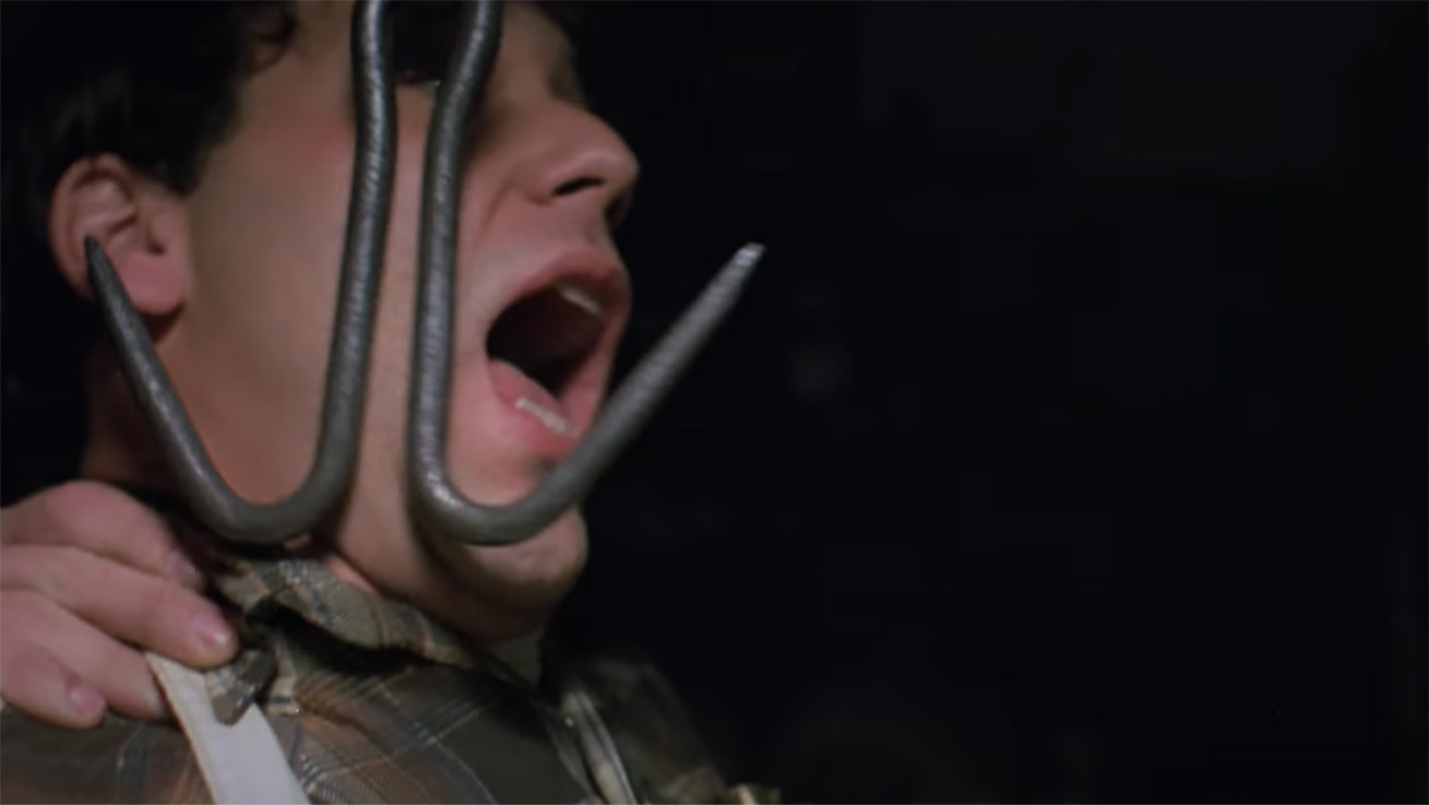 A man getting hooked in the neck in Intruder (1989)