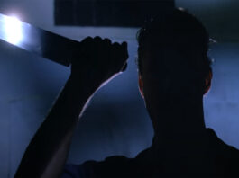 The silhouette of a person holding a knife in Intruder (1989)