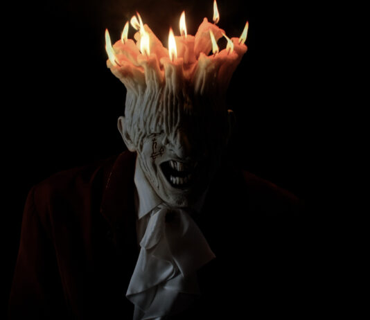 A monstrous man with no eyes and candles on his head in Tenebris Somnia