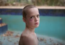 Jonah Wren Phillips as Ollie in a pool in Bring Her Back