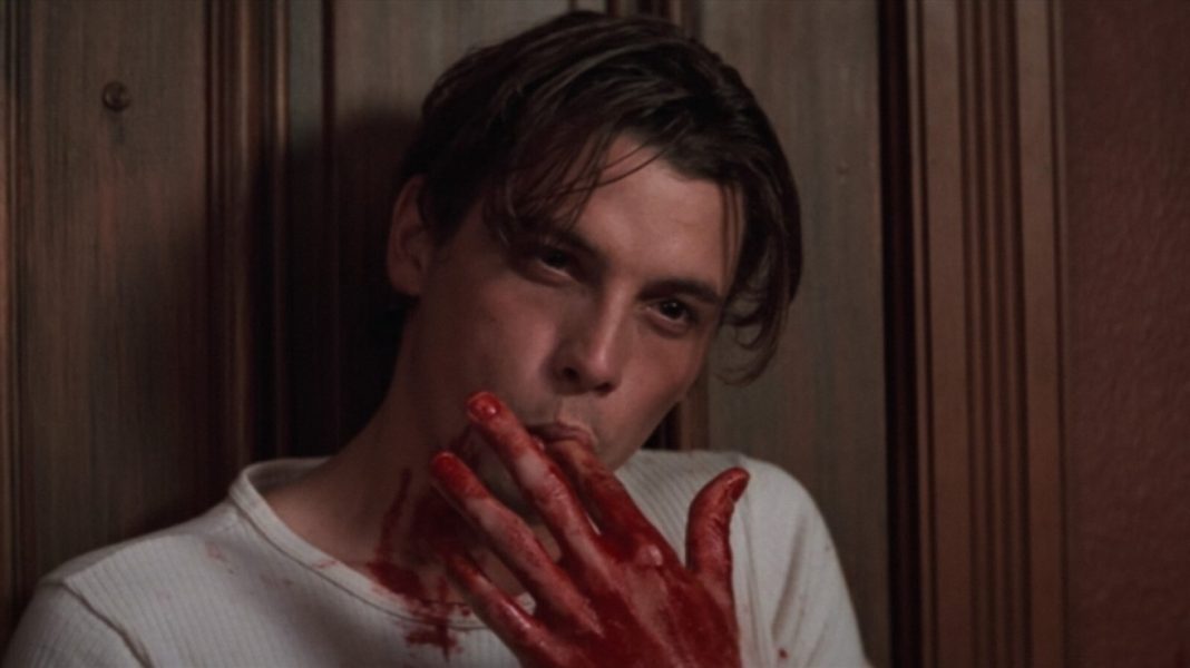 Billy Loomis in Scream (1) Skeet Ulrich as Billy Loomis licking corn syrup off his hand in Scream