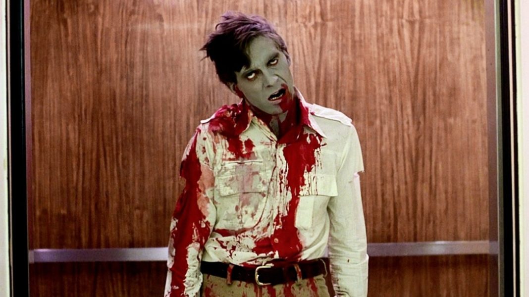 A zombie covered with blood in the elevator in Dawn of the Dead (1978)