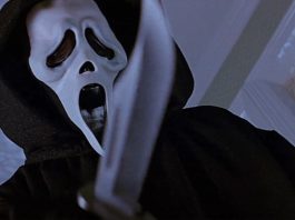 Ghostface holding a knife to the camera in Scream