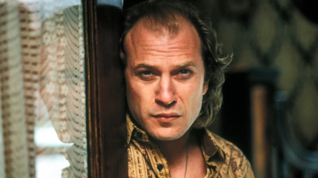 Ted LEvine as Buffalo Bill standing in a doorway in Silence of the Lambs (1991).