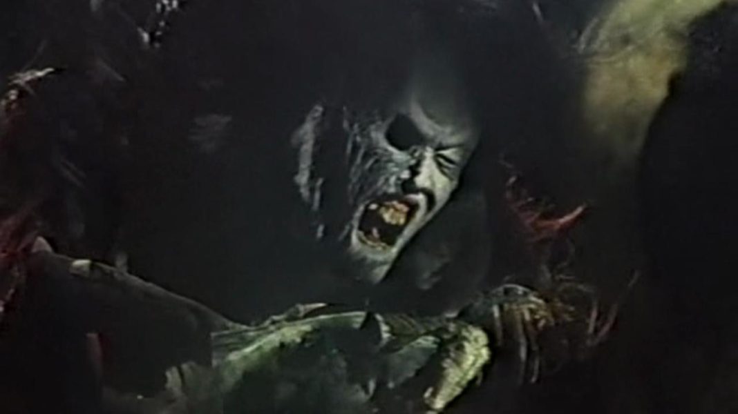 A ghost woman holding the body of her child in Sweet Home (1989)