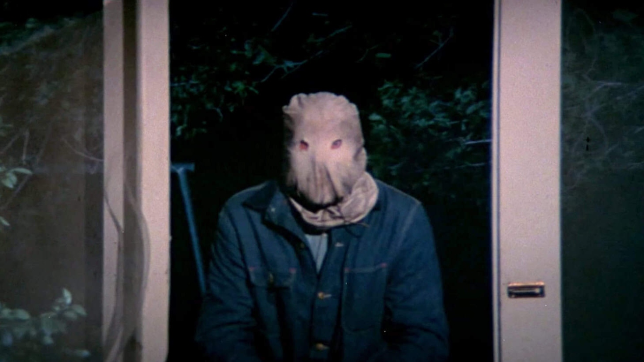 The Phantom Killer wearing a burlap sack mask in The Town That Dreaded Sundown