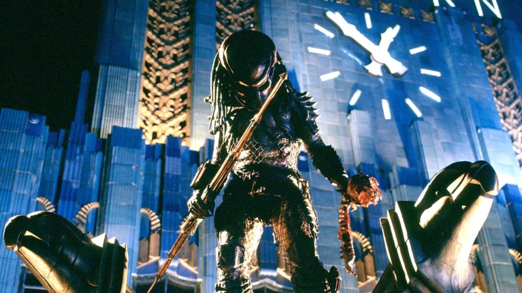 The Yautja from Predator 2 (1990) standing on a building