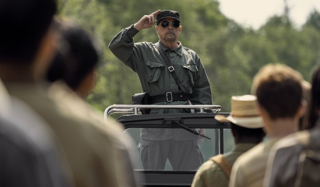 The Major salutes in front of the young men