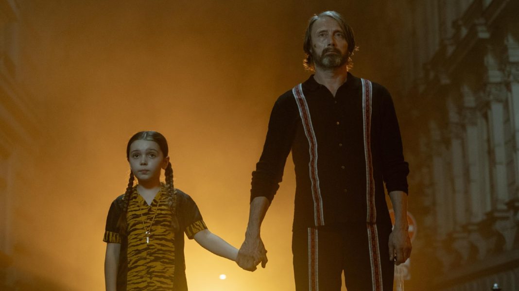 Mads Mikkelsen stands next to a young girl in Dust Bunny Mads Mikkelsen stands next to a young girl in Dust Bunny