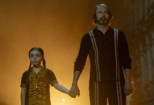 ‘Dust Bunny’ Review: Mads Mikkelsen Turns Monster Hunter Mads Mikkelsen stands next to a young girl in Dust Bunny