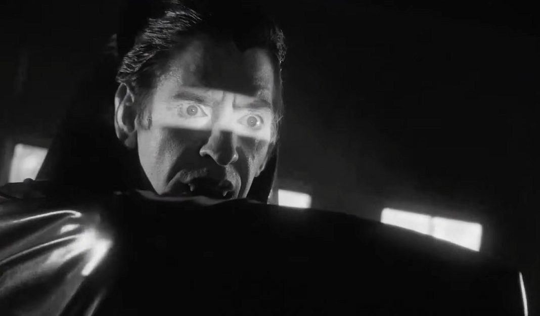 Dracula holds his cape in front of his face in VAMPIRE ZOMBIES... FROM SPACE!