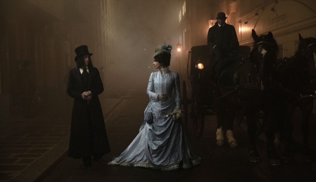 Mina talks to Dracula on a foggy street in Dracula 2026