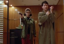 Two actors holding guns from On the Run (1988)