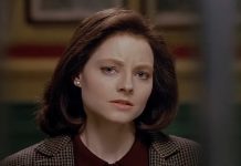 Clarice Starling (Jodie Foster) stands outside of Hannibal's cell in The Silence of the Lambs