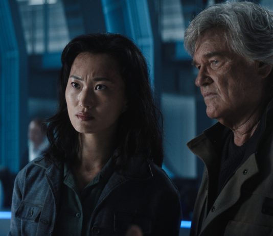 Joe Tippett, Mari Yamamoto and Kurt Russell talk in a lab in Monarch Legacy of Monsters Season 2, Ep. 2 'Resonance'