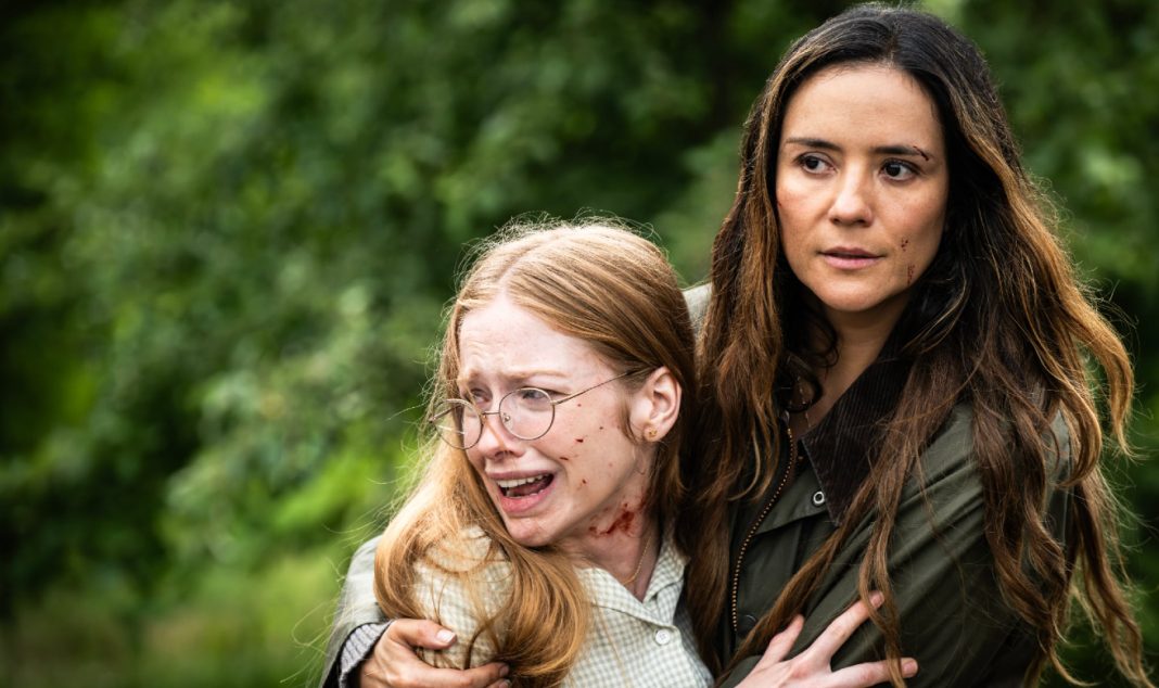 A bloody Sophia holds onto Tabitha Mathews while crying in FROM Season 4, Episode 1