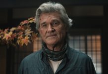 An older Lee Shaw (Kurt Russell) looks concerned while standing in house in Monarch Legacy of Monsters Season 2, Episode 7
