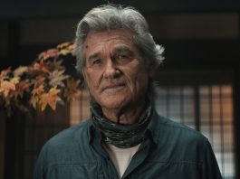 An older Lee Shaw (Kurt Russell) looks concerned while standing in house in Monarch Legacy of Monsters Season 2, Episode 7