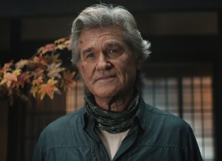 An older Lee Shaw (Kurt Russell) looks concerned while standing in house in Monarch Legacy of Monsters Season 2, Episode 7