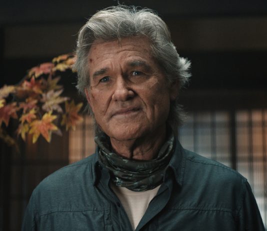 An older Lee Shaw (Kurt Russell) looks concerned while standing in house in Monarch Legacy of Monsters Season 2, Episode 7