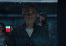 An older Lee Shaw (Kurt Russell) looks out of a rain-soaked window in Monarch Legacy of Monsters Season 2, Episode 9 'Ends of the Earth'