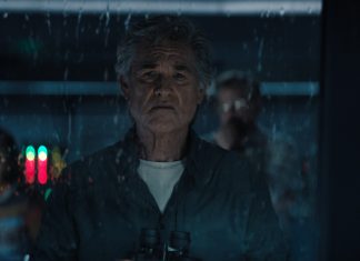 An older Lee Shaw (Kurt Russell) looks out of a rain-soaked window in Monarch Legacy of Monsters Season 2, Episode 9 'Ends of the Earth'