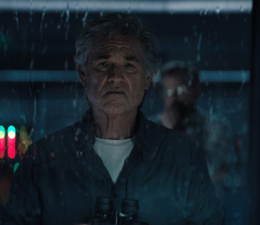 An older Lee Shaw (Kurt Russell) looks out of a rain-soaked window in Monarch Legacy of Monsters Season 2, Episode 9 'Ends of the Earth'