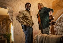 Boyd and Donna Raines talk while they stand at a staircase in FROM Season 4 Episode 1
