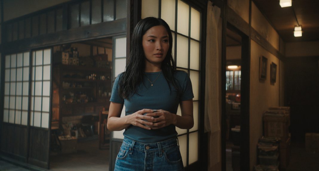Cate (Anna Sawai) looks concerned while standing in house in Monarch Legacy of Monsters Season 2, Episode 7