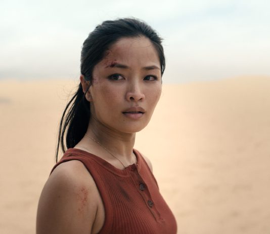 Cate Randa looks at something in Monarch Legacy of Monsters Season 2, Episode 8 'Separate Ways'