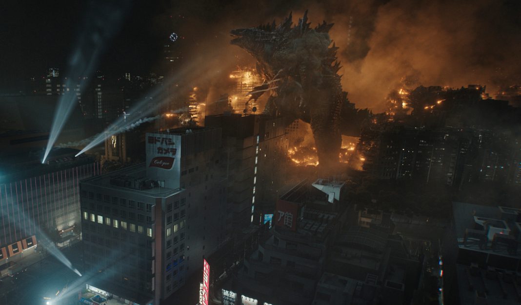 Godzilla walks through a cityline on fire in Monarch Legacy of Monsters Season 2, Episode 6, 'Requiem'