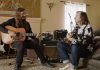 Redd Kross playing guitars in a living room in BORN INNOCENT THE REDD KROSS STORY