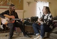 Redd Kross playing guitars in a living room in BORN INNOCENT THE REDD KROSS STORY