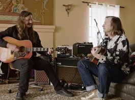 Redd Kross playing guitars in a living room in BORN INNOCENT THE REDD KROSS STORY