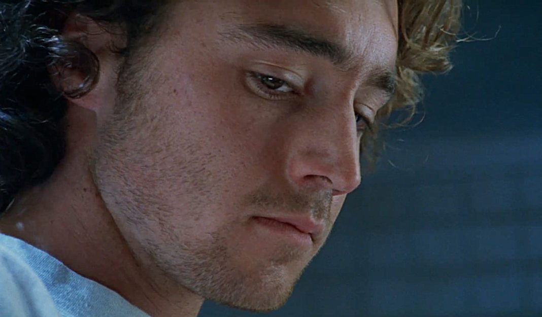 Simon looks down while in an interview in The Ugly