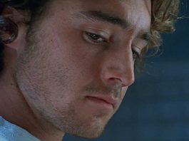 Simon looks down while in an interview in The Ugly