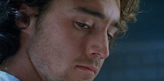 Simon looks down while in an interview in The Ugly