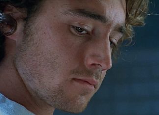 Simon looks down while in an interview in The Ugly