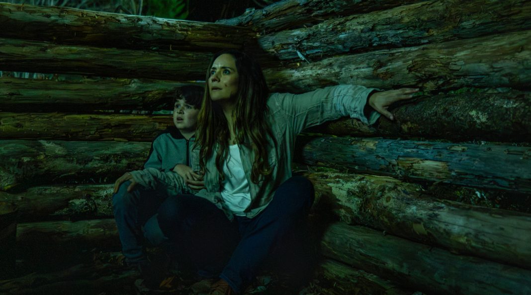 Ethan Matthews and Tabitha Matthews hide in a log fort in the woods at night in FROM Season 4 Episode 5