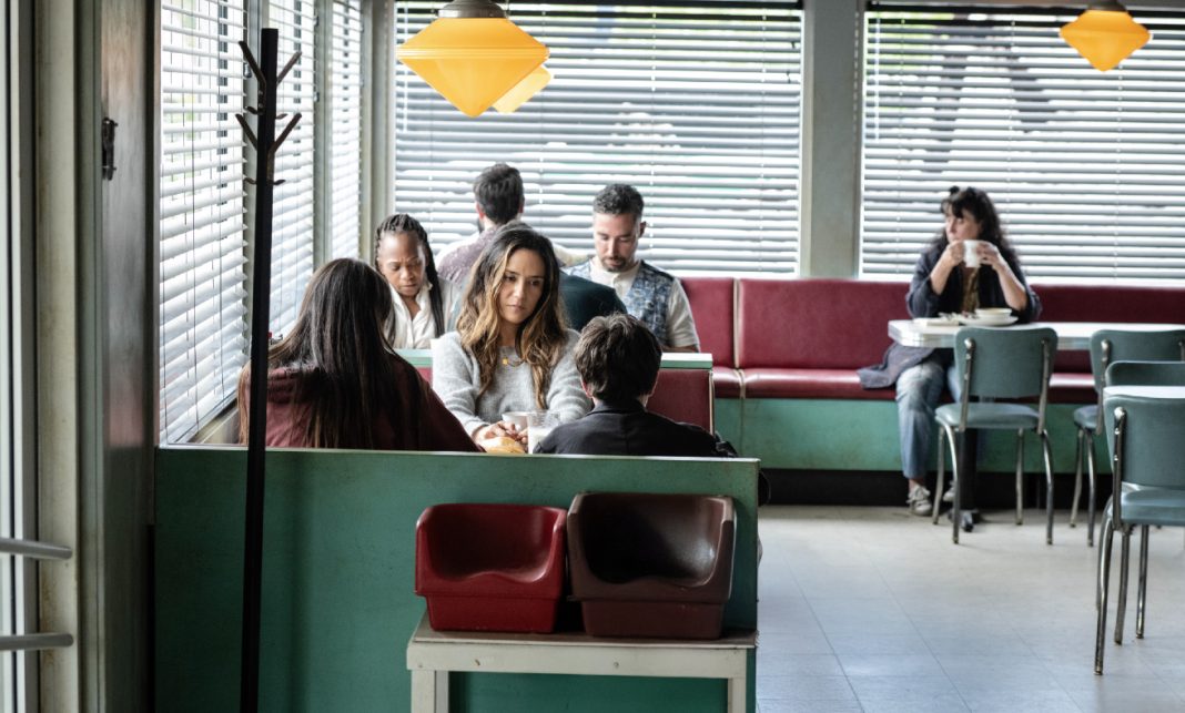 Tabitha (Catalina Sandino Moreno) sits at a diner in FROM Season 4, Episode 3