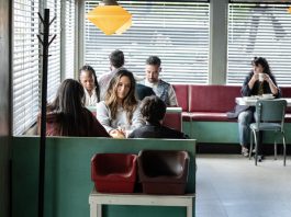 Tabitha (Catalina Sandino Moreno) sits at a diner in FROM Season 4, Episode 3