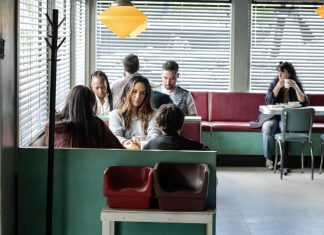 Tabitha (Catalina Sandino Moreno) sits at a diner in FROM Season 4, Episode 3