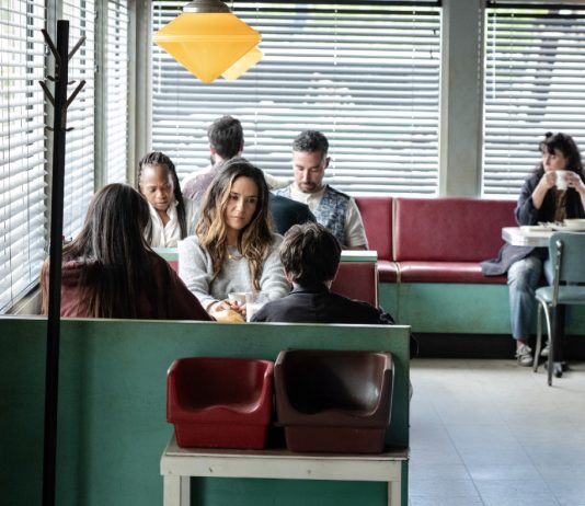 Tabitha (Catalina Sandino Moreno) sits at a diner in FROM Season 4, Episode 3
