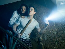 A husband and wife come down the stairs in fear in the Paranormal Activity Stage Play