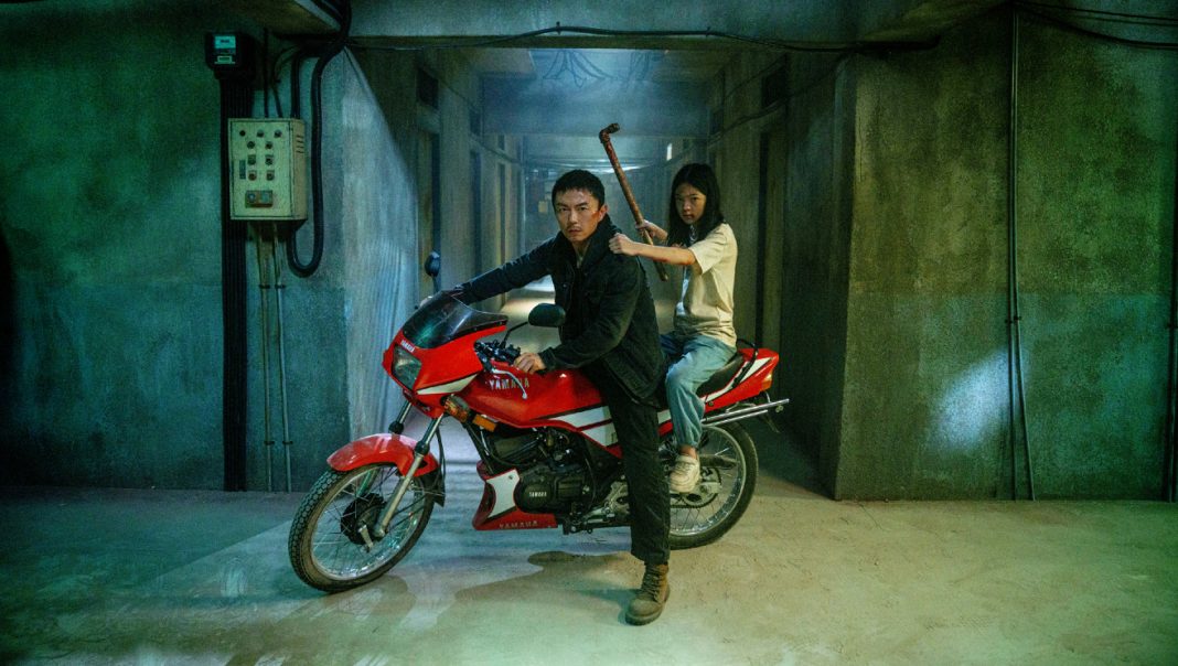 A man and his daughter sit on a motorcycle in The Furious A man and his daughter sit on a motorcycle in The Furious