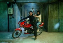 A man and his daughter sit on a motorcycle in The Furious