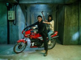 A man and his daughter sit on a motorcycle in The Furious