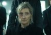 A woman gets pushed in a wheelchair to a funeral in The Voices of Our Mother