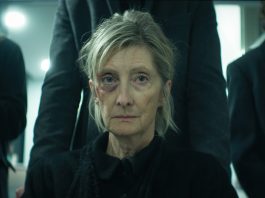 A woman gets pushed in a wheelchair to a funeral in The Voices of Our Mother