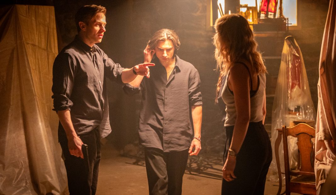 Siblings argue in a basement in The Voices of Our Mother